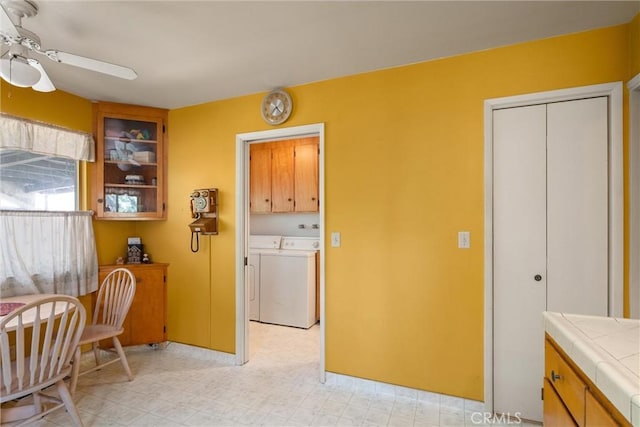 14693 Lafayette Cir, Magalia, CA 95954 - living area featuring a ceiling fan, separate washer and dryer, and light floors