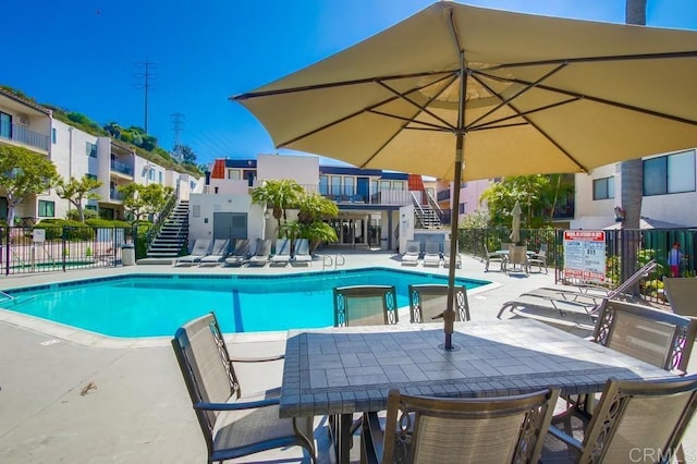 6780 Friars Rd Unit 269, San Diego, CA 92108 - community pool featuring stairs, a patio area, and outdoor dining space