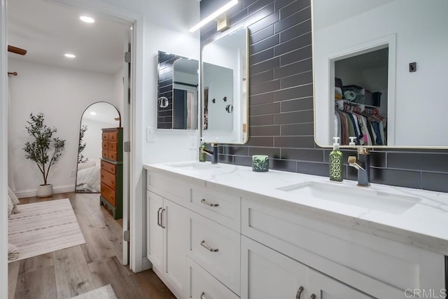 6780 Friars Rd Unit 269, San Diego, CA 92108 - bathroom with wood finished floors, double vanity, ensuite bath, recessed lighting, and a spacious closet