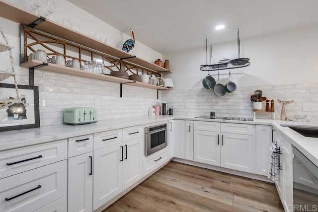 6780 Friars Rd Unit 269, San Diego, CA 92108 - kitchen featuring open shelves, black electric stovetop, stainless steel dishwasher, decorative backsplash, and white cabinetry