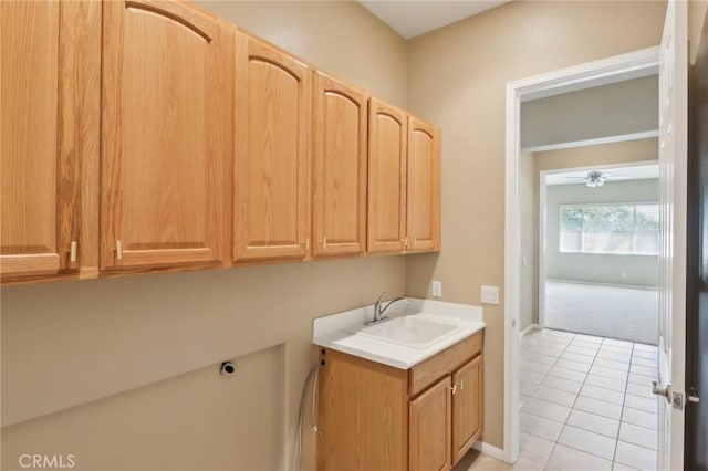 1704 Golden Way, Beaumont, CA 92223 - washroom with light tile patterned flooring, cabinet space, a ceiling fan, electric dryer hookup, and baseboards