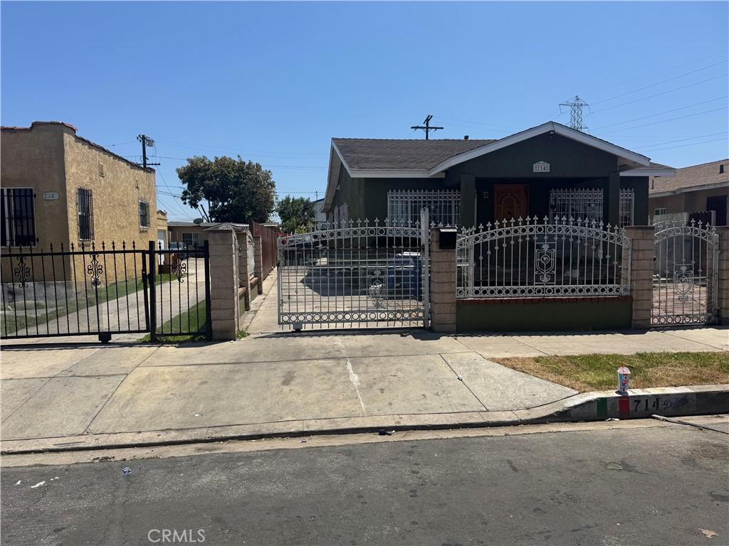 714 E 110th St, Los Angeles, CA 90059 - view of front facade with a fenced front yard and a gate