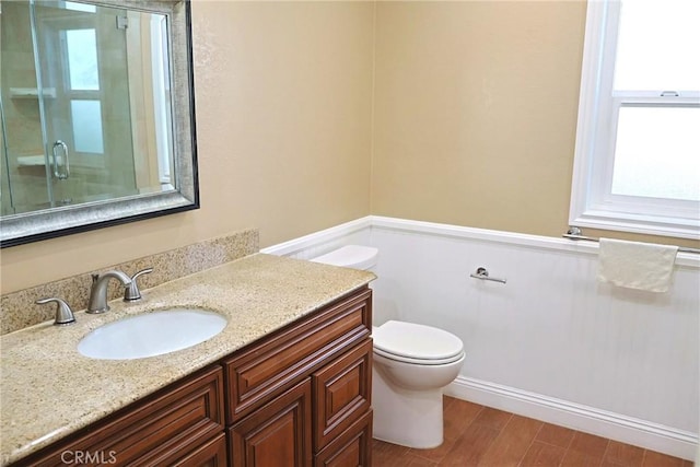18907 Felbar Ave, Torrance, CA 90504 - full bathroom with toilet, vanity, a shower with shower door, and wood finished floors