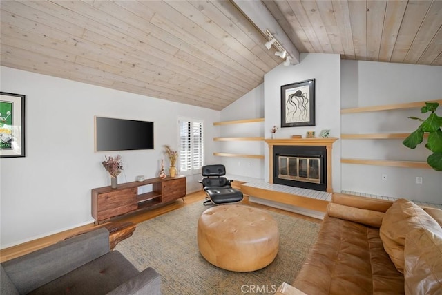 2350 Meadow St, San Luis Obispo, CA 93401 - living area featuring wooden ceiling, vaulted ceiling, rail lighting, wood finished floors, and a glass covered fireplace
