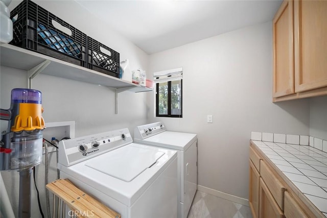 2350 Meadow St, San Luis Obispo, CA 93401 - laundry room with independent washer and dryer, baseboards, and cabinet space