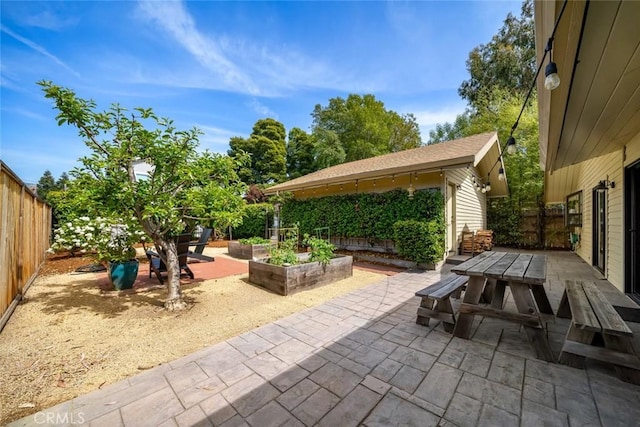 2350 Meadow St, San Luis Obispo, CA 93401 - fenced backyard featuring a patio, outdoor dining space, and a garden