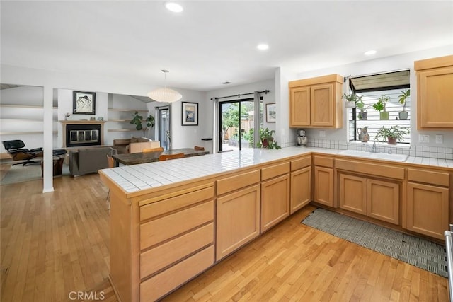 2350 Meadow St, San Luis Obispo, CA 93401 - kitchen with a sink, tile countertops, a peninsula, open floor plan, and recessed lighting