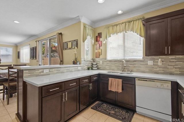 1207 Barton Peak Dr, Chula Vista, CA 91913 - kitchen with white dishwasher, a sink, a peninsula, light countertops, and light tile patterned floors