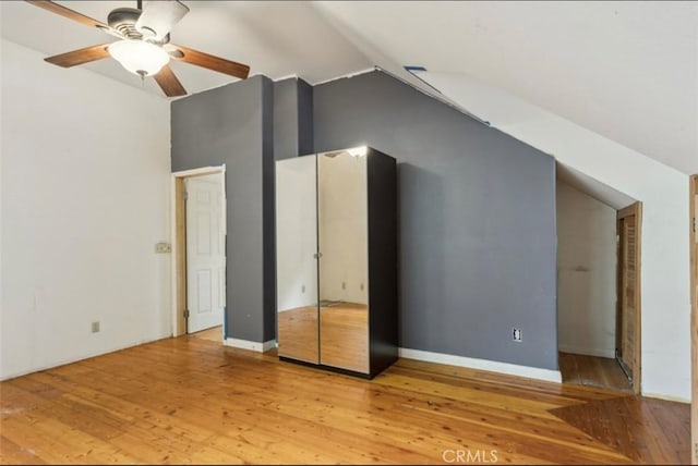 2711 E Washington St, Carson, CA 90810 - unfurnished bedroom featuring lofted ceiling, light wood finished floors, and ceiling fan