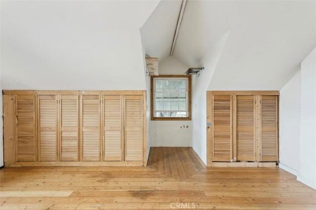 2711 E Washington St, Carson, CA 90810 - unfurnished bedroom featuring wood finished floors