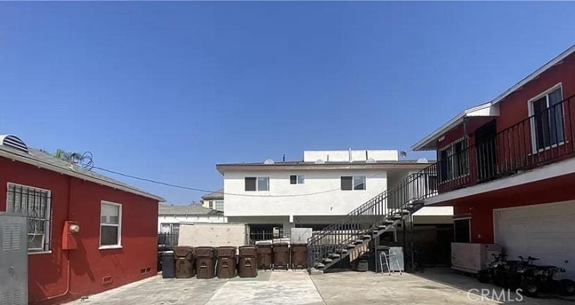 202 N Sloan Ave, Compton, CA 90221 - rear view of house featuring stairway