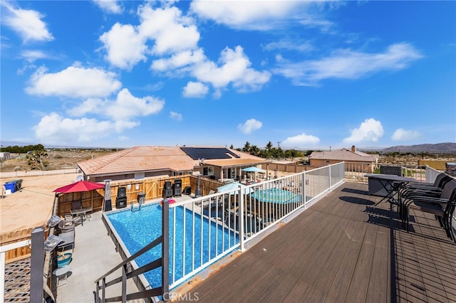 10779 Mills Rd, Apple Valley, CA 92308 - view of swimming pool featuring a patio area and a deck