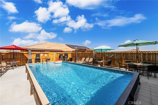 10779 Mills Rd, Apple Valley, CA 92308 - view of swimming pool featuring a patio, a fenced backyard, and outdoor dining area
