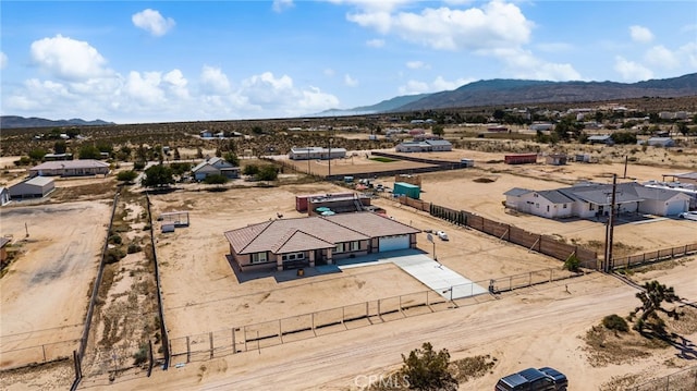 10779 Mills Rd, Apple Valley, CA 92308 - aerial view of property and surrounding area featuring a mountain backdrop and a desert landscape