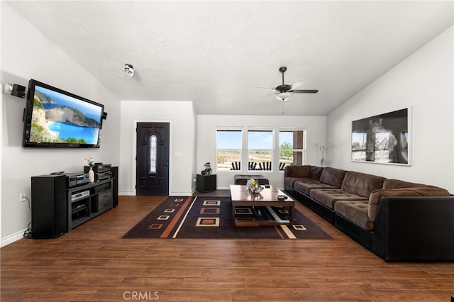 10779 Mills Rd, Apple Valley, CA 92308 - living area with a ceiling fan, wood finished floors, vaulted ceiling, and baseboards