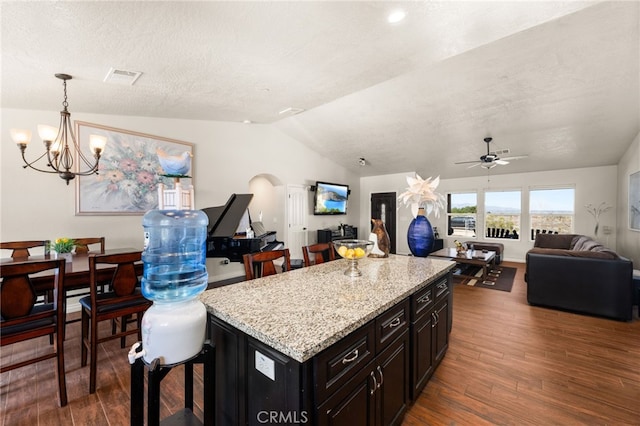 10779 Mills Rd, Apple Valley, CA 92308 - kitchen with open floor plan, vaulted ceiling, a chandelier, dark wood finished floors, and a kitchen island
