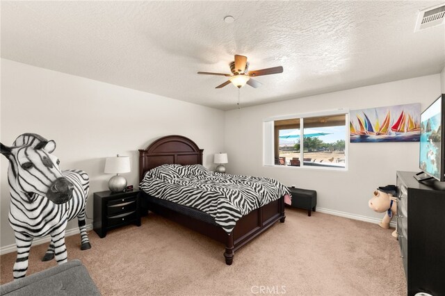 10779 Mills Rd, Apple Valley, CA 92308 - bedroom featuring light carpet, baseboards, a ceiling fan, and a textured ceiling