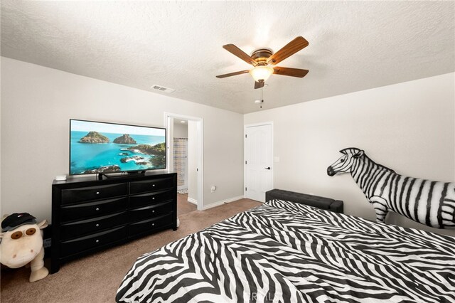 10779 Mills Rd, Apple Valley, CA 92308 - bedroom featuring carpet floors, a textured ceiling, a ceiling fan, baseboards, and connected bathroom