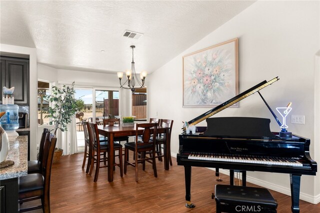 10779 Mills Rd, Apple Valley, CA 92308 - dining space with a chandelier, wood finished floors, baseboards, and lofted ceiling