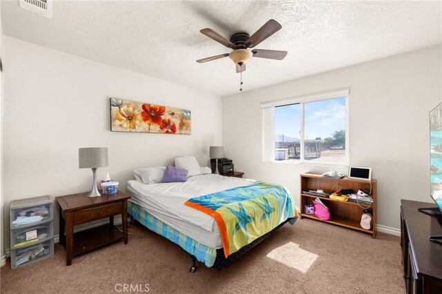 10779 Mills Rd, Apple Valley, CA 92308 - bedroom featuring light colored carpet, a ceiling fan, and a textured ceiling
