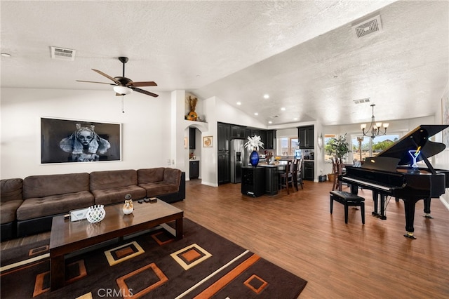 10779 Mills Rd, Apple Valley, CA 92308 - living area with wood finished floors, ceiling fan, vaulted ceiling, a textured ceiling, and a chandelier