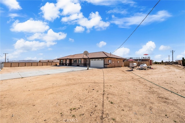 10779 Mills Rd, Apple Valley, CA 92308 - view of front of home with a garage and driveway