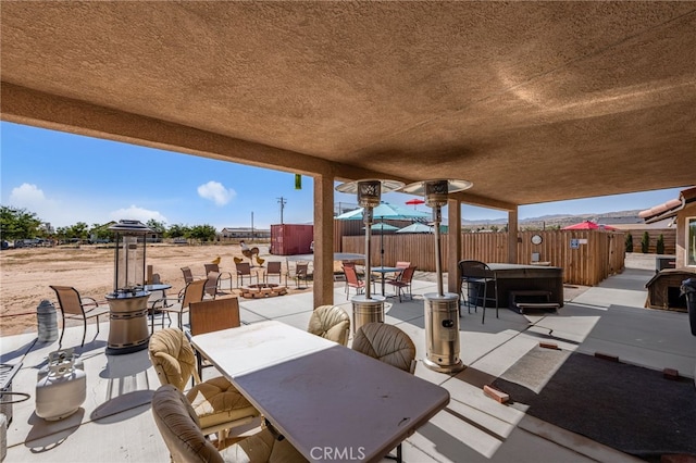 10779 Mills Rd, Apple Valley, CA 92308 - view of patio featuring a hot tub and outdoor dining space