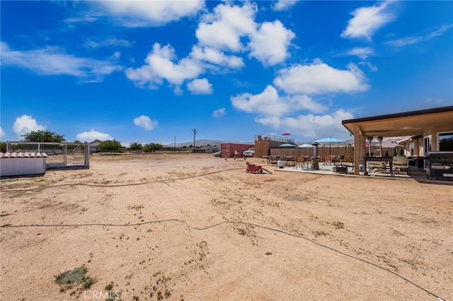 10779 Mills Rd, Apple Valley, CA 92308 - view of yard featuring a patio