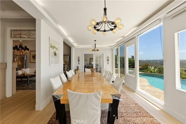 3610 Monserate Hill Ct, Fallbrook, CA 92028 - dining space featuring a chandelier, light wood-type flooring, and baseboards