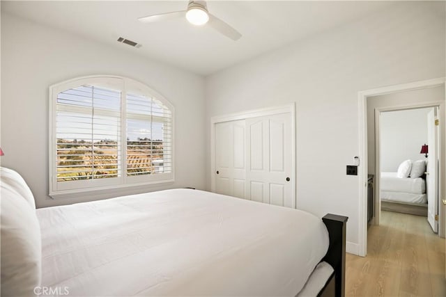 3610 Monserate Hill Ct, Fallbrook, CA 92028 - bedroom with light wood finished floors, a closet, ceiling fan, and baseboards