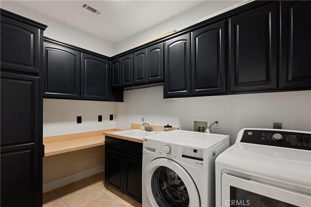 3610 Monserate Hill Ct, Fallbrook, CA 92028 - washroom featuring cabinet space, independent washer and dryer, and light tile patterned floors