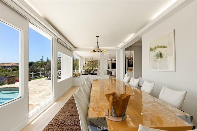 3610 Monserate Hill Ct, Fallbrook, CA 92028 - dining area with a chandelier and light wood-type flooring
