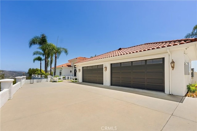 3610 Monserate Hill Ct, Fallbrook, CA 92028 - view of front facade with a tile roof, driveway, stucco siding, and a garage