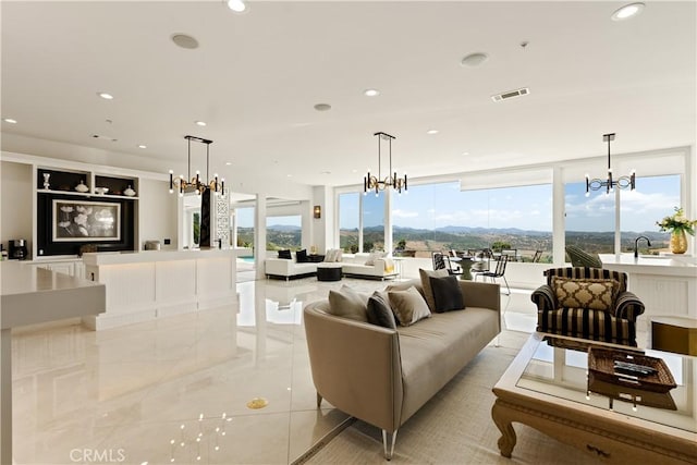 3610 Monserate Hill Ct, Fallbrook, CA 92028 - living area with a chandelier, healthy amount of natural light, recessed lighting, and light tile patterned floors