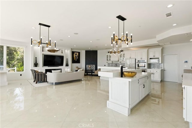3610 Monserate Hill Ct, Fallbrook, CA 92028 - kitchen with a chandelier, stainless steel appliances, light countertops, and recessed lighting