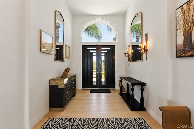 3610 Monserate Hill Ct, Fallbrook, CA 92028 - foyer with light wood finished floors, french doors, baseboards, and a chandelier