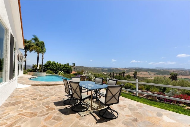 3610 Monserate Hill Ct, Fallbrook, CA 92028 - view of patio featuring a mountain view, a pool with connected hot tub, and outdoor dining area