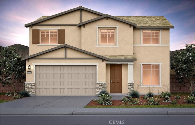 4261 Empressa Cir, Lake Elsinore, CA 92530 - view of front of home featuring a garage, stone siding, stucco siding, and concrete driveway