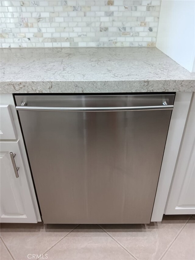 18 Goldenbush, Irvine, CA 92604 - kitchen view of dishwasher, decorative backsplash, light countertops, and white cabinets