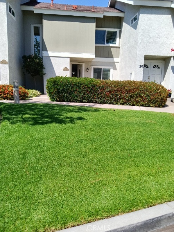 18 Goldenbush, Irvine, CA 92604 - view of front of home featuring a front yard and stucco siding
