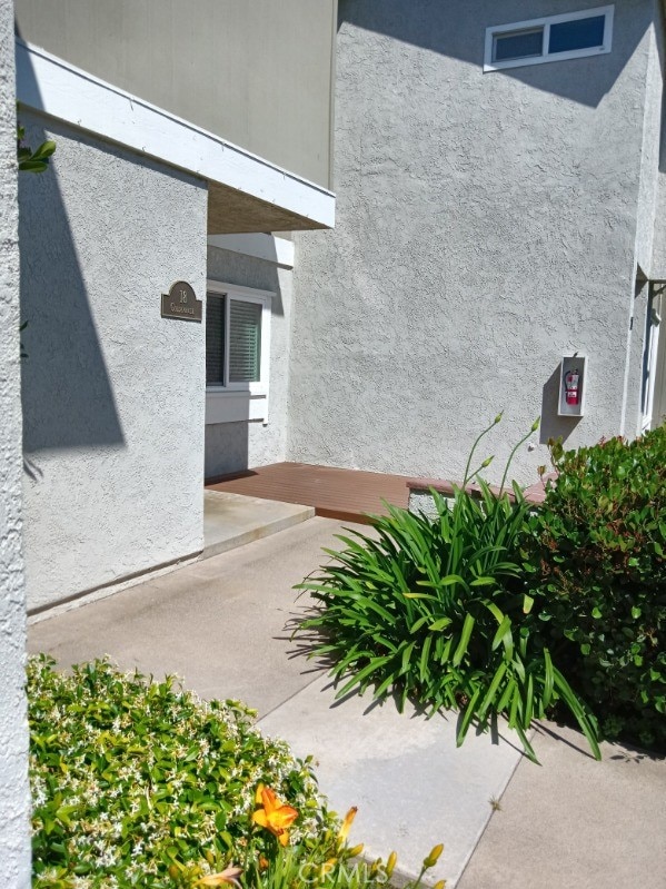 18 Goldenbush, Irvine, CA 92604 - entrance to property featuring stucco siding and a patio