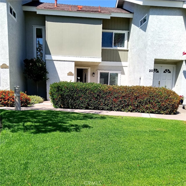 18 Goldenbush, Irvine, CA 92604 - view of front of home featuring a front lawn and stucco siding