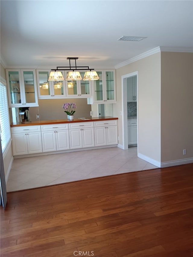 18 Goldenbush, Irvine, CA 92604 - unfurnished dining area with ornamental molding and light wood finished floors