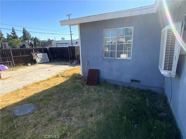 215 W 23rd St, San Bernardino, CA 92405 - view of side of home featuring stucco siding, a patio area, and crawl space