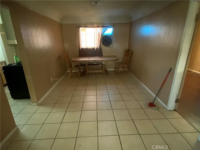 215 W 23rd St, San Bernardino, CA 92405 - unfurnished dining area featuring light tile patterned flooring and baseboards