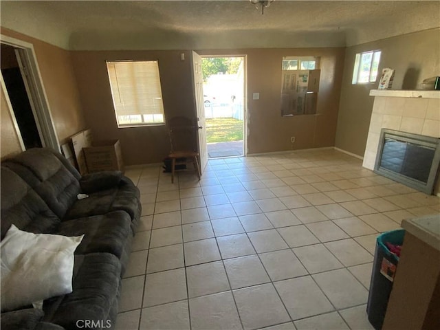 215 W 23rd St, San Bernardino, CA 92405 - living area featuring a tile fireplace and light tile patterned floors