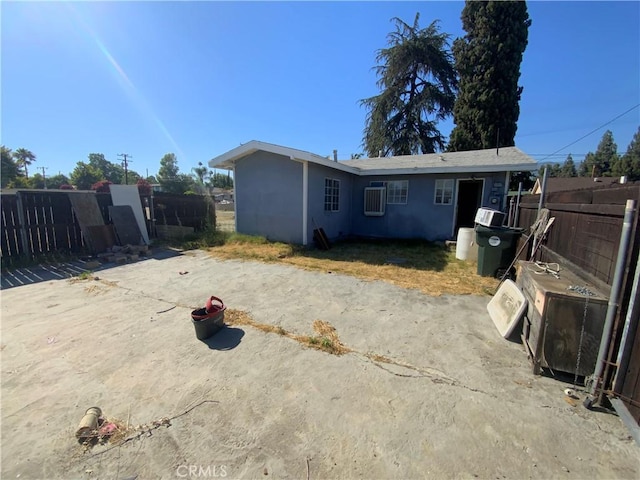 215 W 23rd St, San Bernardino, CA 92405 - rear view of property featuring stucco siding