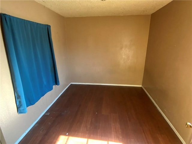 215 W 23rd St, San Bernardino, CA 92405 - unfurnished room featuring wood finished floors and a textured ceiling