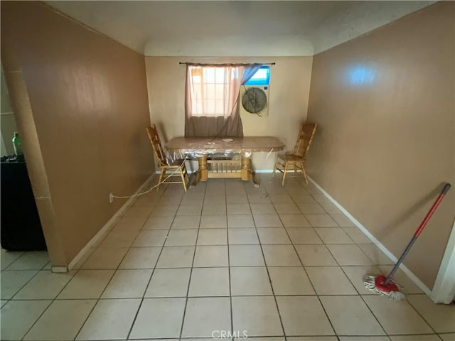 215 W 23rd St, San Bernardino, CA 92405 - unfurnished dining area with light tile patterned floors and baseboards