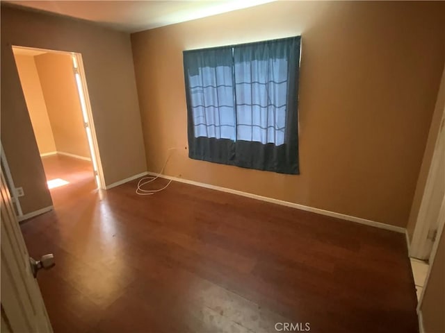 215 W 23rd St, San Bernardino, CA 92405 - unfurnished room featuring wood finished floors and baseboards